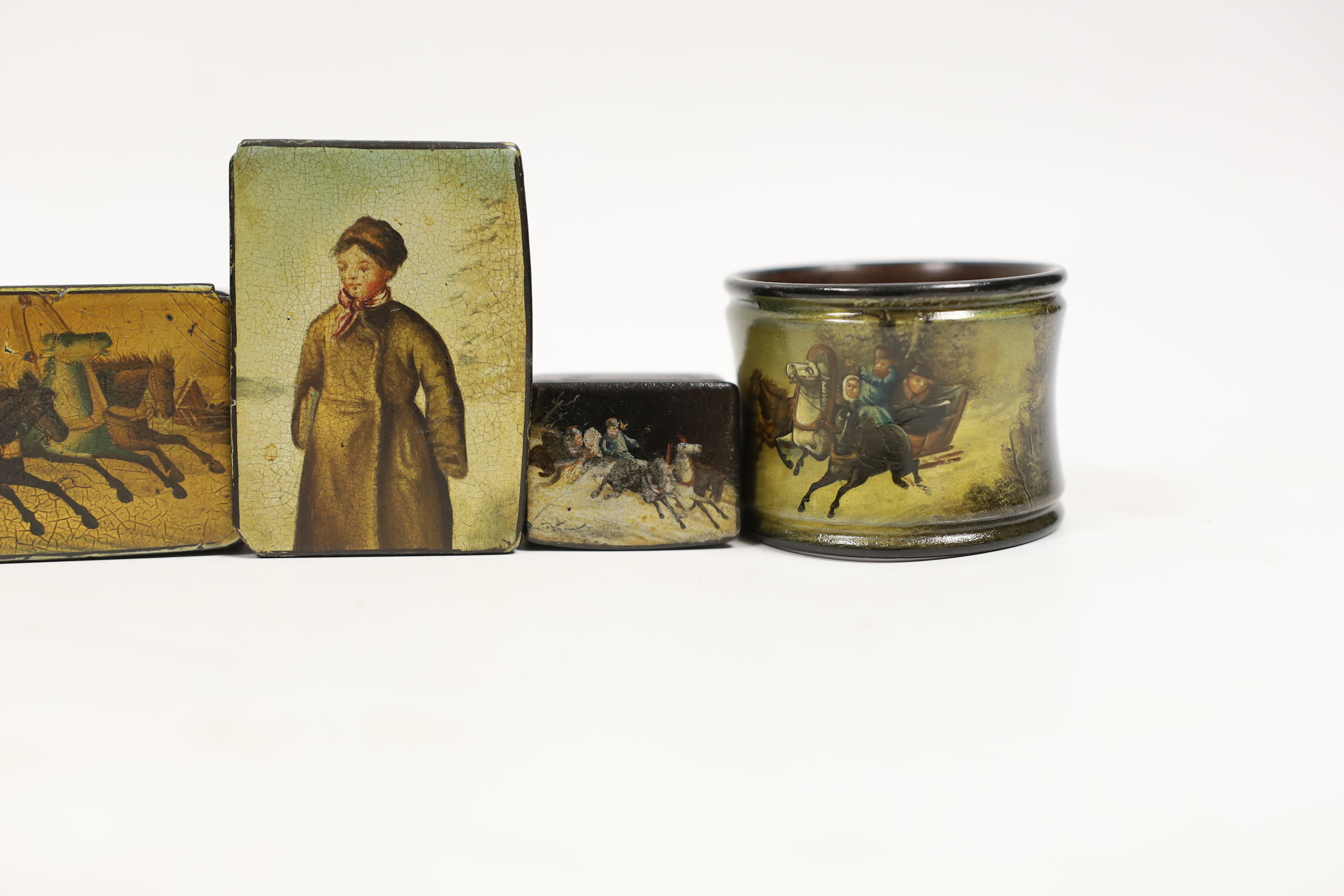 Four small Russian lacquer snuff boxes and a napkin ring, by Vishnyakov, painted with Troika and figure scenes, largest 7.7 cm wide (5)